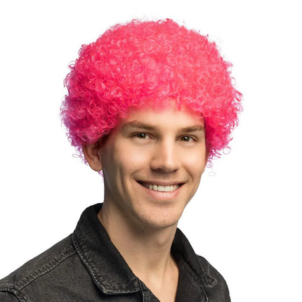 Pruik Curly neonroze UV van Boland koop je bij Partywinkel